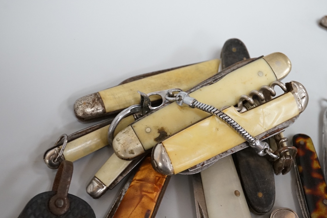 A collection of assorted penknives and whistles